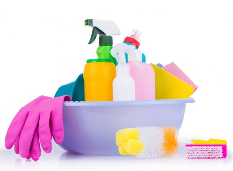 Vacuuming a sofa to remove dust and allergens