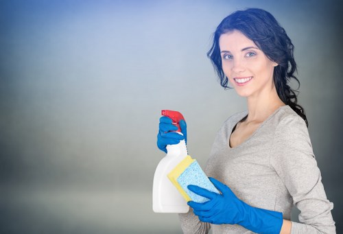 Technician performing deep carpet cleaning with equipment