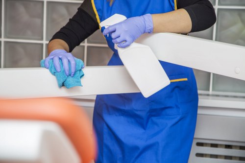 Technician performing commercial carpet cleaning in a high-traffic hallway